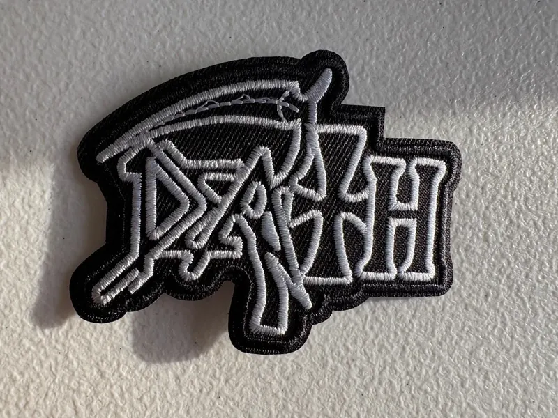 Embroidered patch with detailed stitched lettering